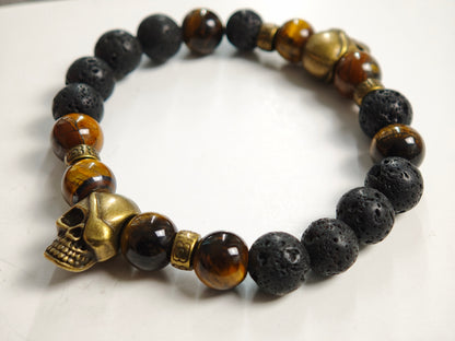 Edelstein-Armband „Earth & Fire“ – Tigerauge & Lavastein mit Bronze-Skulls